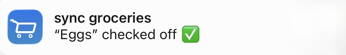 A Sync Groceries notification reading: Eggs checked off
